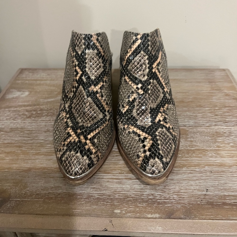Faux snake skin backless booties. I’m moving abroad so downsizing closet!